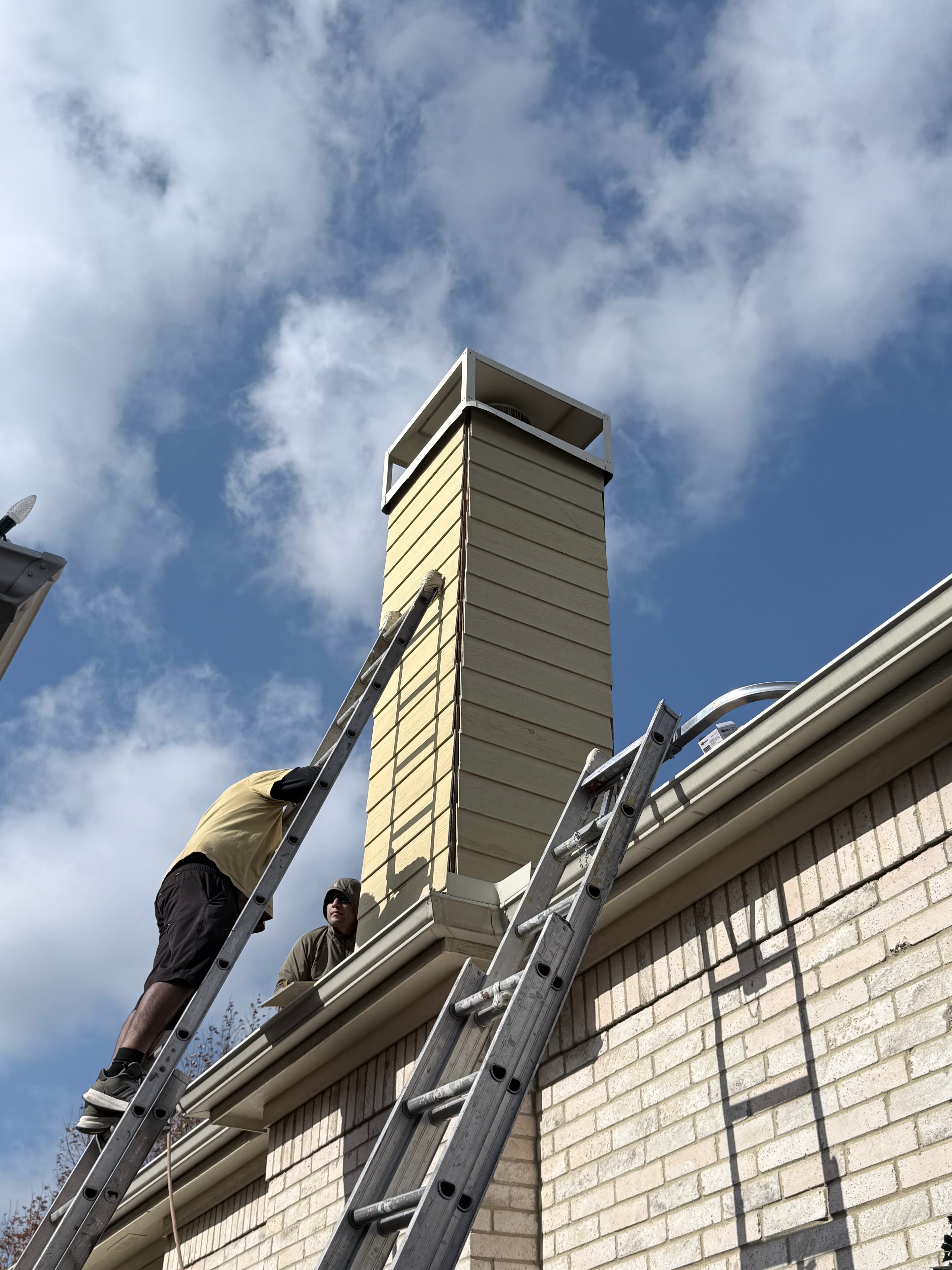 Professional exterior restoration team working on Dallas home - quality craftsmanship and attention to detail